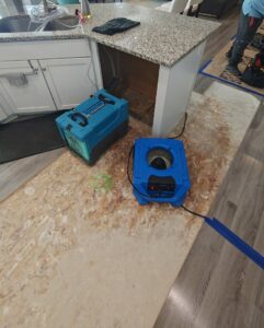 Kitchen water damage drying equipment and subfloor exposure by 4 Seasons Restoration LLC in Midvale, UT.
