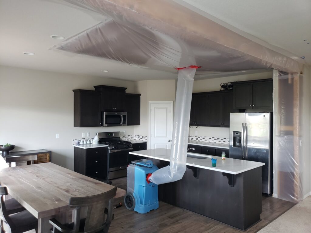 A kitchen undergoing water damage drying with specialized equipment by PacWest Restoration in Tigard, OR