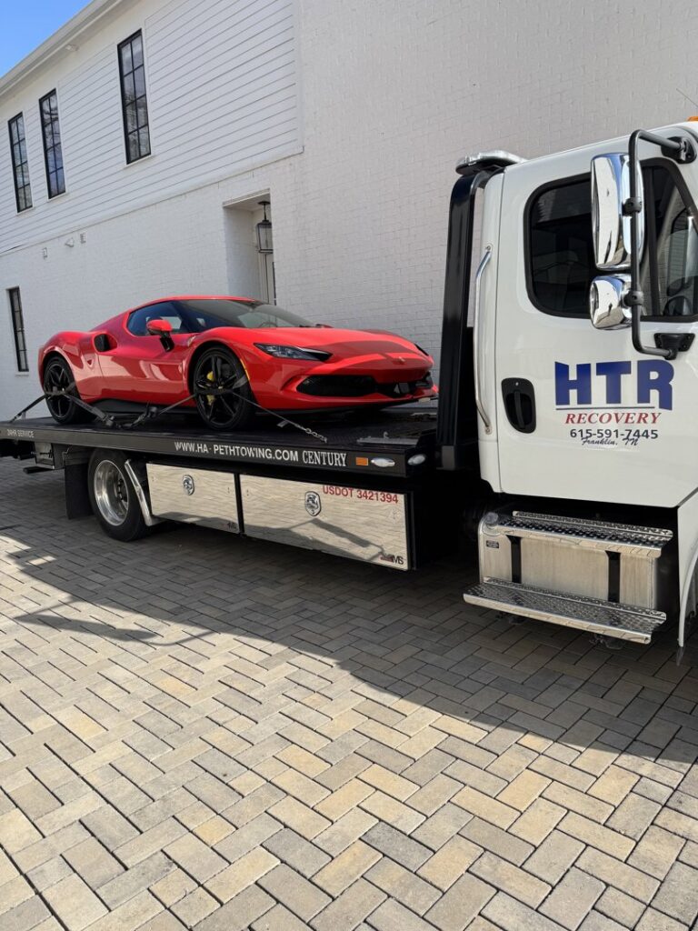 Kubota mini excavators being transported on a flatbed truck by Harpeth Towing & Recovery in Franklin, TN.