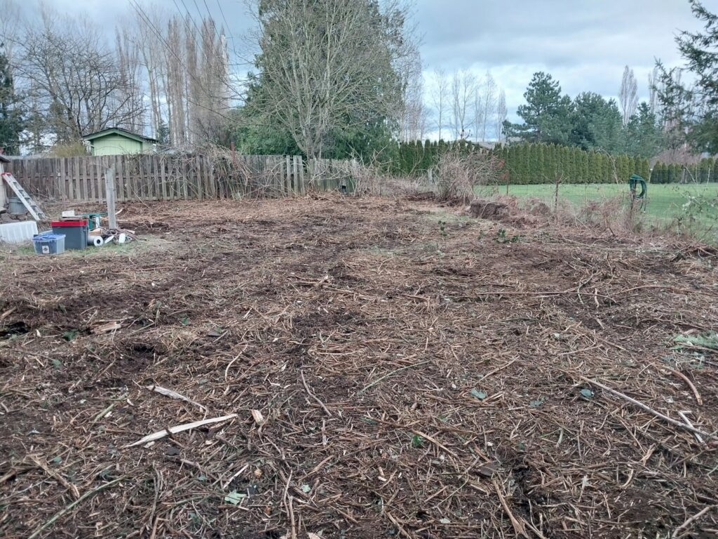 Recently cleared land with debris, showcasing land clearing and site preparation by ROUGH 2 READY in Auburn, AL