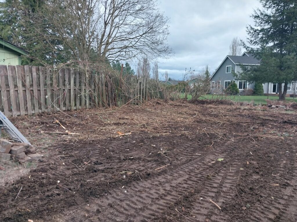A land clearing project showing removed vegetation and prepared ground by ROUGH 2 READY in Auburn, AL