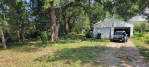 Large area brush clearing and mowing service by Lovett lawn care & snow removal in Omaha, NE.