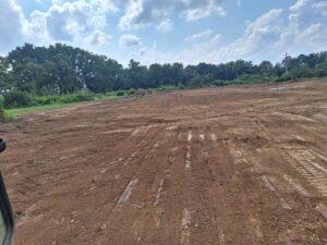 A large expanse of cleared land, indicating site preparation by Cornerstone Demolition & Excavation in Lexington, KY