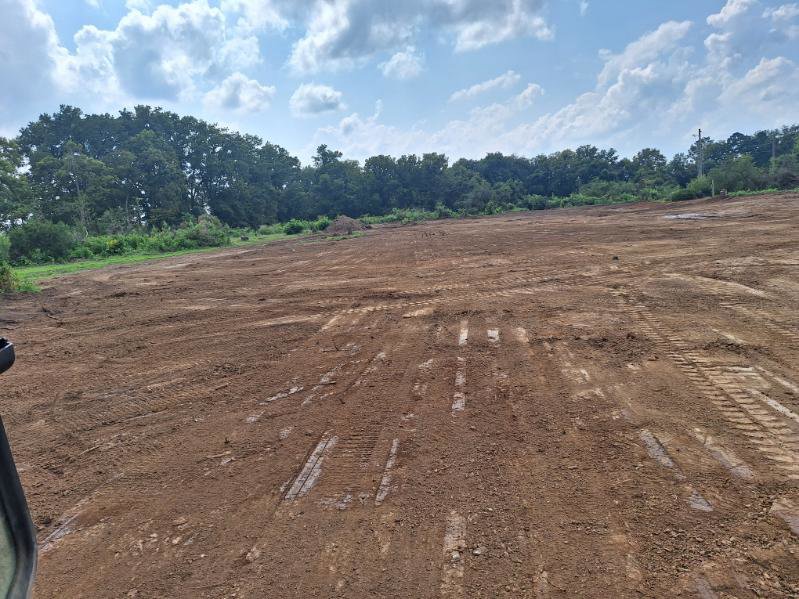 A large expanse of cleared land, indicating site preparation by Cornerstone Demolition & Excavation in Lexington, KY