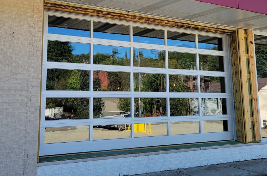 Large commercial glass garage door installation by Access Door Systems, serving businesses in Uniontown, PA.