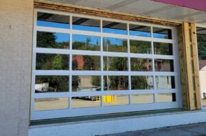 Large commercial glass garage door installation by Access Door Systems, serving businesses in Uniontown, PA.