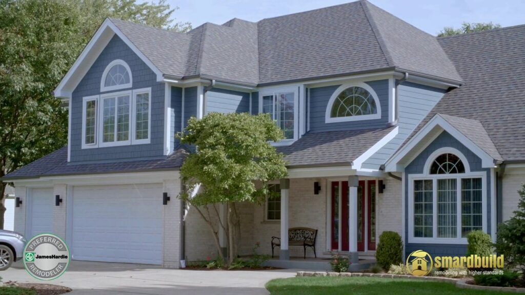 A large residential home featuring blue siding and white brick installed by SmardBuild Siding and Exteriors in Naperville, IL