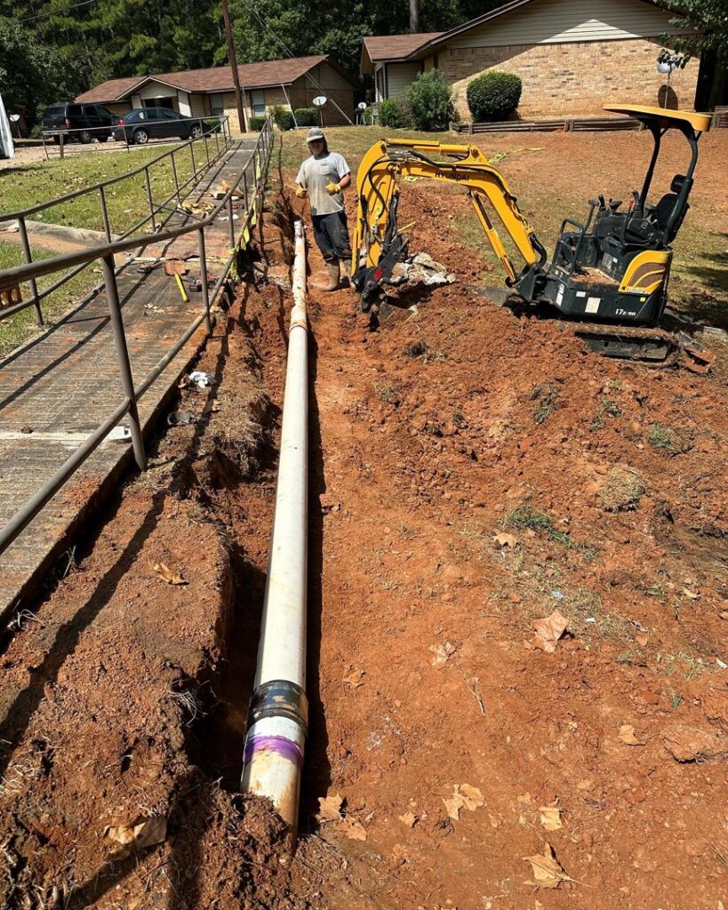 A large pipe being installed in a trench for water damage repair by Robert Brown Plumbing, LLC in Bossier City, LA.