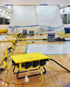 Large-scale water damage drying operation with equipment and containment by Specialized Cleaning & Restoration, Inc. in Bismarck, ND.