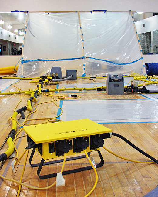 Large-scale water damage drying operation with equipment and containment by Specialized Cleaning & Restoration, Inc. in Bismarck, ND.