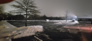 Large snow piles in a commercial parking lot after snow removal by Yard Monkeys in Hixson, TN.