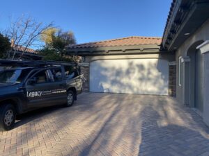 A Legacy ODS Garage Door Services truck parked at a residential job site in Las Vegas, NV.
