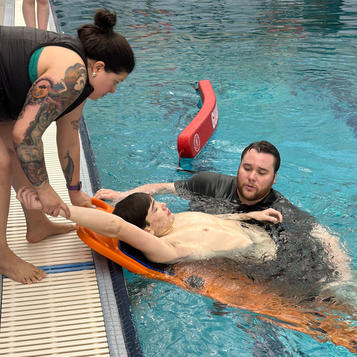 Lifeguard training in progress at an indoor swimming pool managed by Juneau Parks & Recreation in Juneau, AK.
