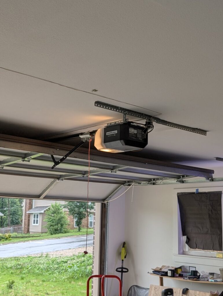 A LiftMaster garage door opener installed on the ceiling, showcasing professional work by LaFrancis Overhead Door LLC in Little Rock, AR