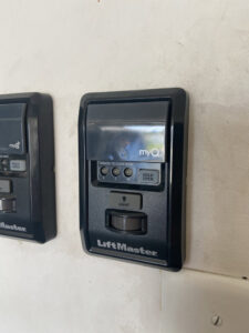A close-up of a LiftMaster garage door wall control unit installed by Bob McDonald Garage Door LLC in Columbus, NE.