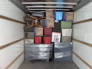 The interior of a moving truck fully loaded with wrapped furniture and boxes by Shield Moving Services in Milwaukee, WI.