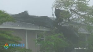 Workers loading water damage restoration equipment into a company van at the warehouse for Premier Restoration Hawaii in Honolulu, HI.