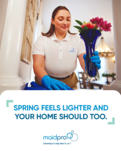 A MaidPro Wichita cleaner in blue gloves wiping a surface in a client's home in Wichita, KS.