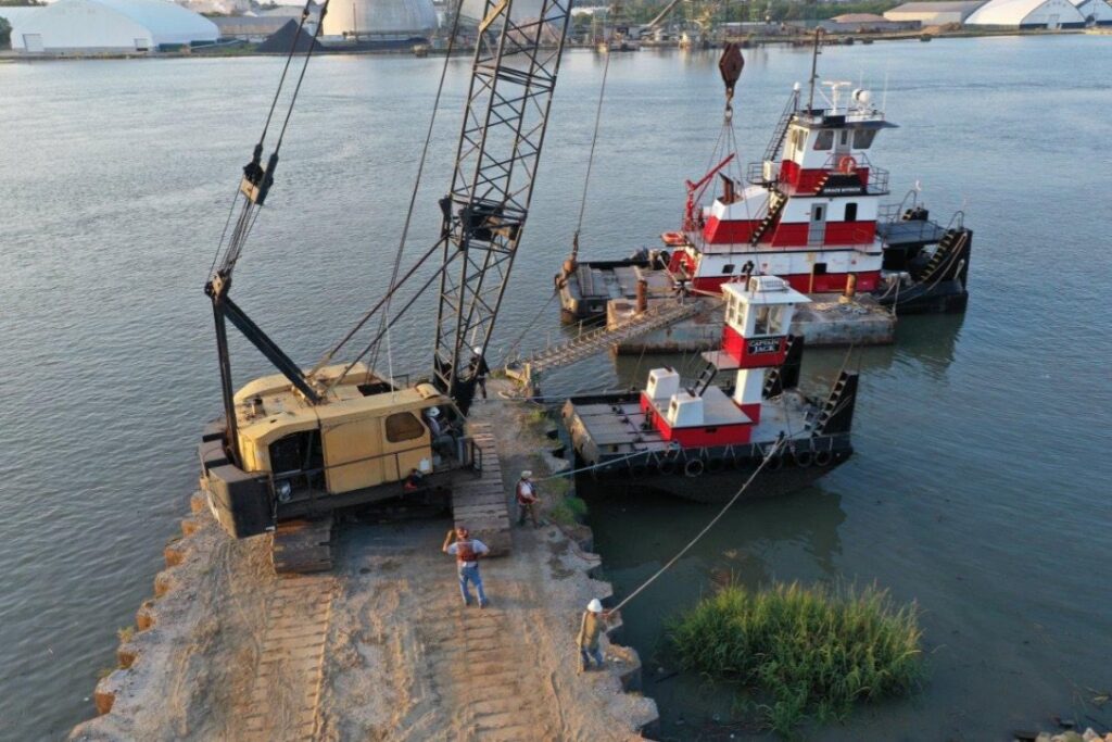 Marine construction work with a tugboat and crane from Myrick Marine Contracting Corp. in Norfolk, VA.