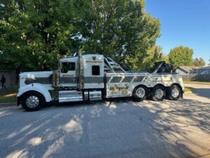 A McDowell Wrecker Service heavy-duty tow truck parked on a residential street in Springfield, MO.