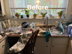 A very messy kitchen counter with dirty dishes before cleaning by The Blake Experience Cleaning Service in Albany, NY.