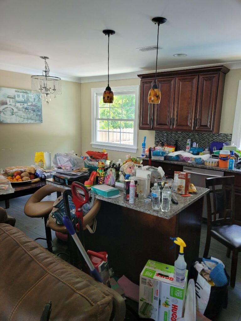 A very messy kitchen and dining area, showing a space ready for cleaning by Evelyn's Cleaning Services in Huntsville, AL.