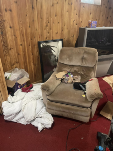 A messy living room before professional cleaning by RitaBee's Cleaning Service LLC in Milwaukee, WI.