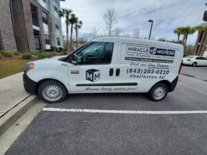 A branded Miracle Movers of Charleston, SC van parked, ready for moving services in Summerville, SC.
