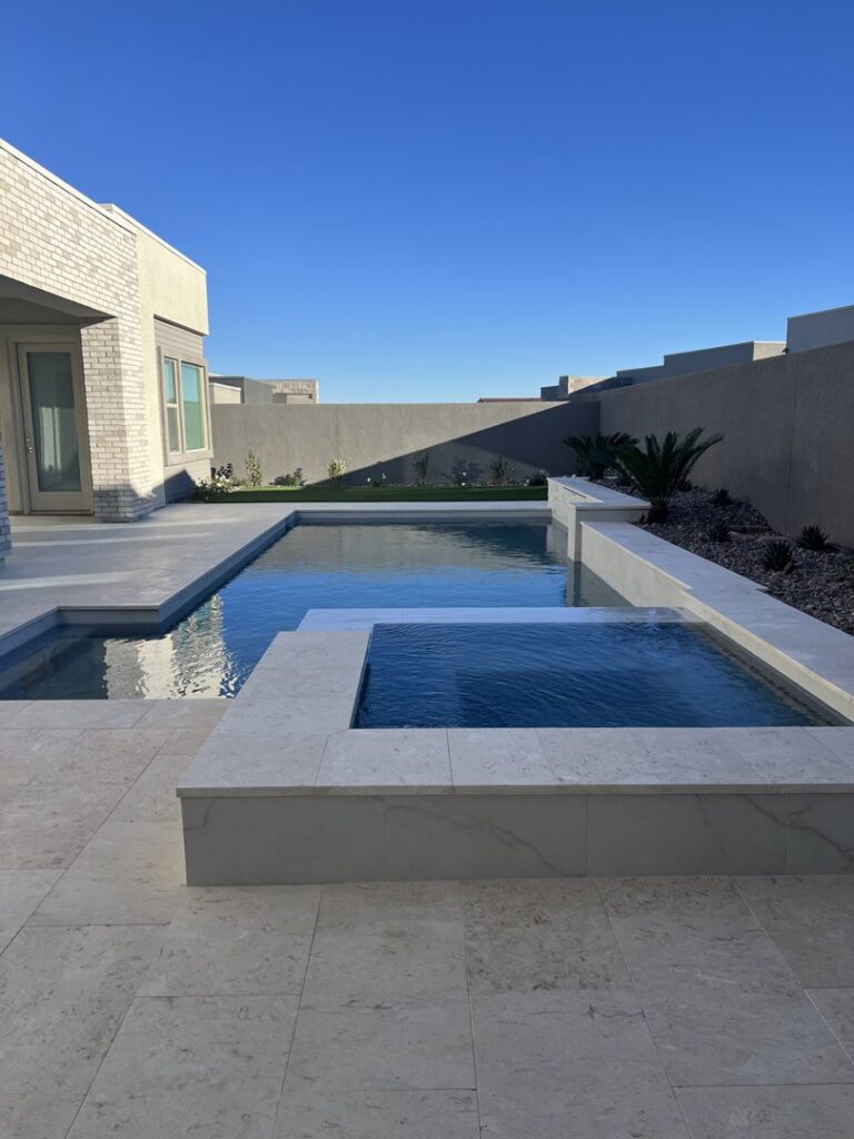 A modern backyard pool and spa area with clean lines by Laguna Pool & Spa and Landscaping in Las Vegas, NV