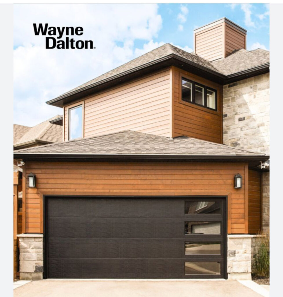 A modern black garage door with windows installed by Total Garage Solutions in Kalispell, MT.
