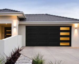 A modern black residential garage door with windows installed by Valley Overhead Door in Las Vegas, NV.
