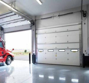 A modern dark gray garage door with horizontal windows installed on a residential home by Wayne Dalton Sales & Service of Albuquerque, NM