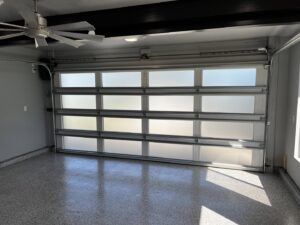 A modern full-view frosted glass garage door from the interior, installed by Over The Top Garage in Albuquerque, NM.