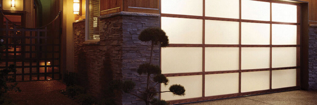 A stylish modern garage door with frosted glass panels and wooden frames installed by ALCAL Specialty Contracting Reno Sparks in Sparks, NV.