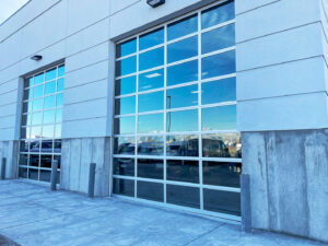 Two modern glass commercial garage doors installed by Canyon Overhead Doors in Salt Lake City, UT.