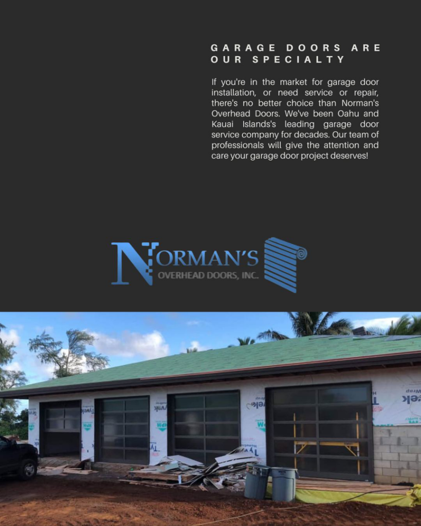 Modern glass garage doors installed on a new construction home by Norman's Overhead Doors, Inc. in Mililani Town, HI.