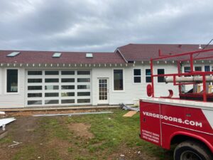 Installation of a modern glass panel garage door by Jonathan at Verge Entrance Solutions/Overhead Door in Hattiesburg, MS.