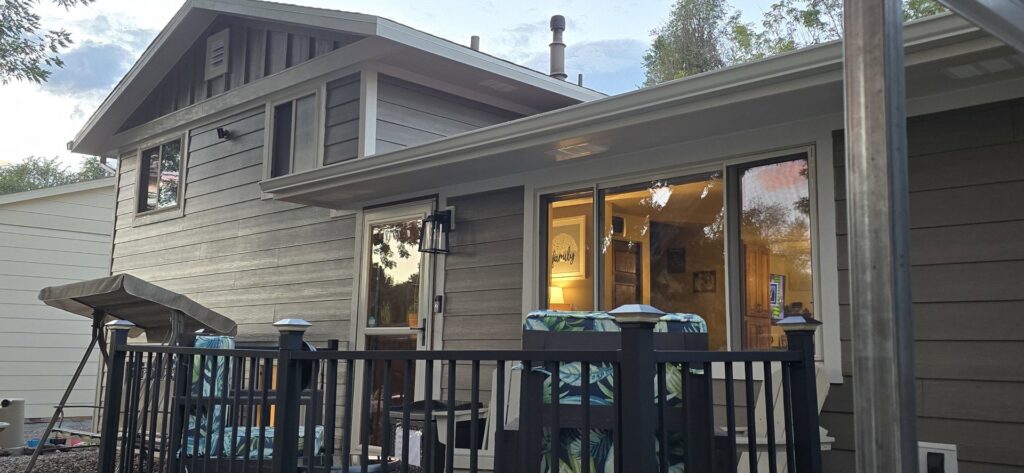 Modern gray siding with vertical accents on a house, expertly installed by EZ General Construction in Colorado Springs, CO.