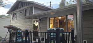 Modern gray siding with vertical accents on a house, expertly installed by EZ General Construction in Colorado Springs, CO.