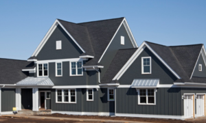 A modern home featuring dark gray siding and white trim, completed by Legend Exteriors & Construction in West Chicago, IL