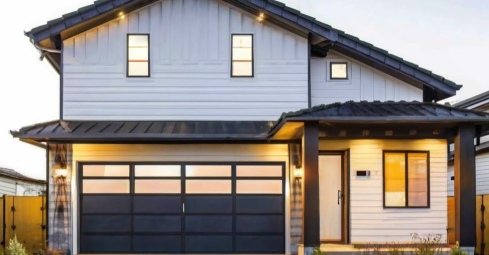A modern house with a black garage door featuring horizontal windows from Jim Dyer Overhead Door in Carson City, NV