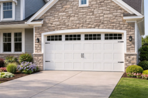 A modern white garage door with windows installed by American Standard Garage Doors - Kansas City Metro in Independence, MO.