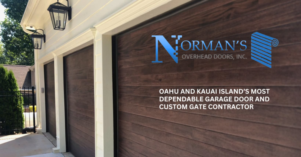 Modern wood-look garage doors installed by Norman's Overhead Doors, Inc. in Mililani Town, HI.