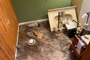 A moisture meter displaying "WET" to indicate significant moisture, used by Minneapolis Water Damage Specialist 24/7 in Minneapolis, MN.