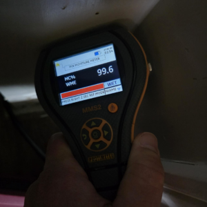 A moisture meter showing a "WET" reading, indicating water damage assessment by PuroClean of Strafford County in Nottingham, NH.