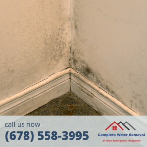 Mold growth in a room corner, indicating water damage requiring restoration by Complete Water Removal and Restoration in Cumming, GA.