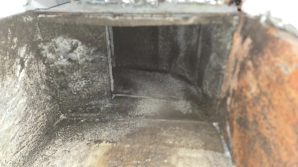 Heavily soiled and moldy HVAC ductwork, indicating severe water damage or moisture problems, addressed by ABS Restoration Services, Inc. in North Little Rock, AR