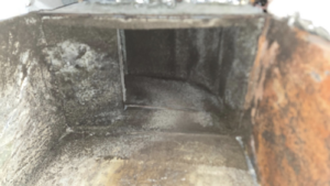 Heavily soiled and moldy HVAC ductwork, indicating severe water damage or moisture problems, addressed by ABS Restoration Services, Inc. in North Little Rock, AR