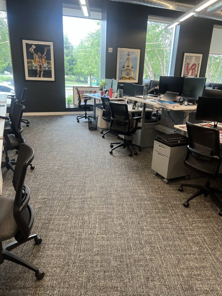 A mop on a shiny hardwood floor in a residential room, indicating cleaning services by Statewide cleaning services llc in Philadelphia, PA.