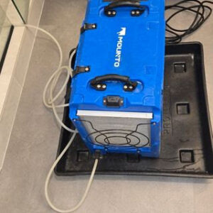 A blue Mounto dehumidifier used for water damage restoration by Harbaugh Restoration in Vancouver, WA.